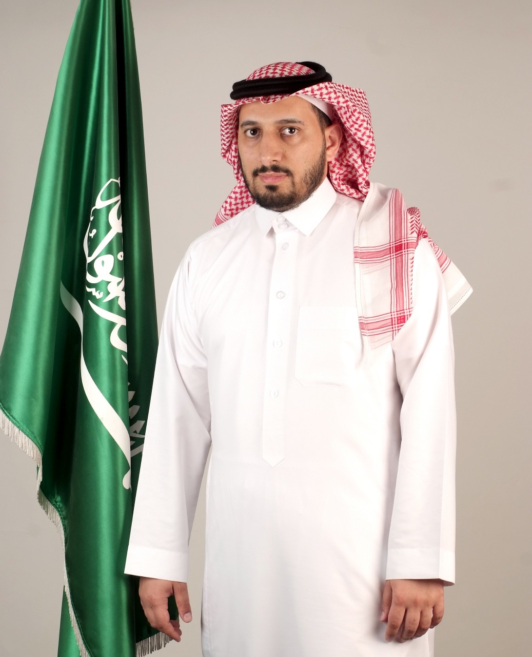 Faisal Hussein Al-Qahtani with Saudi flag